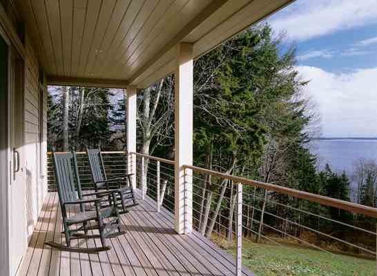 Though nestled into the trees, the Grassi house offers gorgeous views of the Atlantic Ocean. “I love living in a house where looking out at the forest and ocean is part of our daily existence,” Tony says.